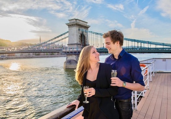 Danube river cruise with a drink in Budapest.jpg