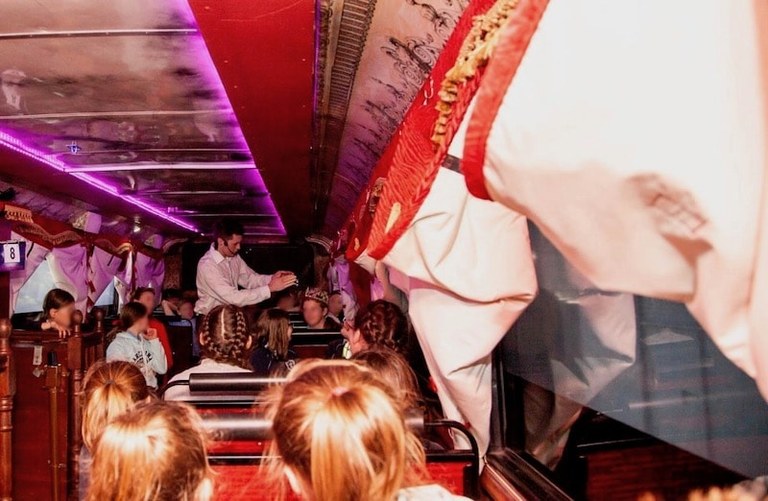 Ghost bus guide telling sppoky stories to children.jpg