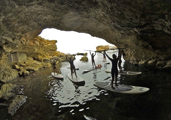 stand up paddle through coastal caves in Ibiza