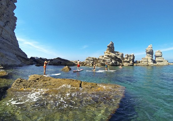 stand up paddle in Ibiza coastal waters and rock formations