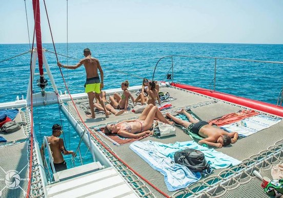 Sunbathing on catamaran Fuerteventura.jpg