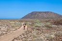 Riding E-bike in Lobos island with volcano cone.jpg