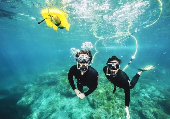 Couple enjoying underwater scuba snorkel in Lobos island.jpg