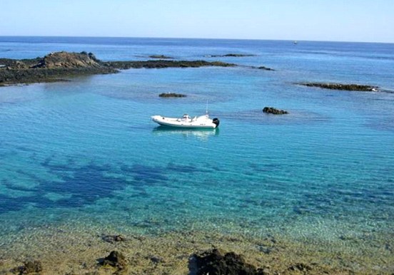 Private boat sailing around Lobos Island