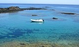Private boat sailing around Lobos Island