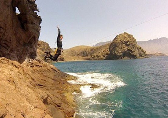 jumping off cliff for Gran Canaria coasteering