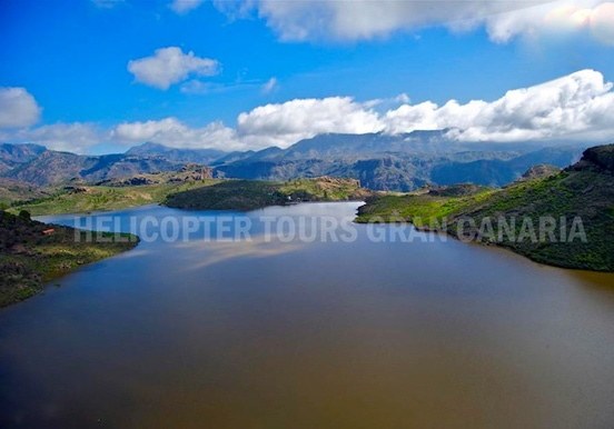 Sight of Gran Canaria's mountain ranges and lake on a helicopter tour
