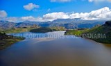 Sight of Gran Canaria's mountain ranges and lake on a helicopter tour