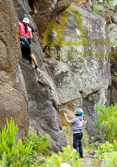 climbing steep rock formation in La Palma