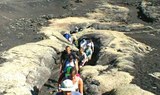 hiking through volcanic rock formation in Lanzarote