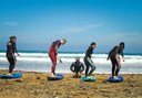 surfing course students with instructor in lanzarote coast