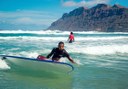 learning to surf in the waves in Lanzarote