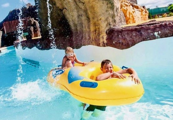 Kids under the waterfall Aqualava waterpark.jpg