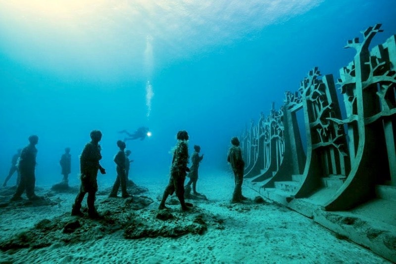 Diving to visit underwater sculptures.jpg