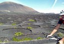 see Lanzarote volcanic landscapes while on road bike tour