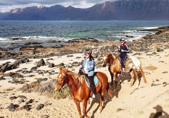 Horse riding on sand Lanzarote.jpg