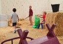 kids playing at the barn in La Granja Verde