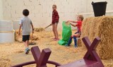 kids playing at the barn in La Granja Verde