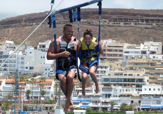 father and daughter parascending in Tenerife