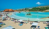 relax at the white sand beach in Siam Park