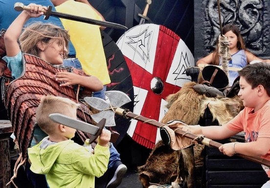 Children viking role play on ragnarok boat trip.jpg