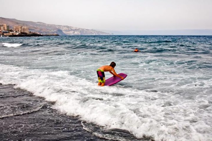 Body boarding at the beach of Candelaria